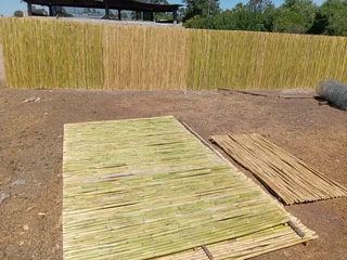 Bamboo fencing and wooden pannels.