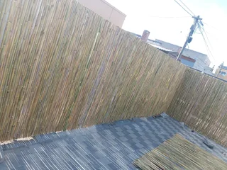 Bamboo fencing and wooden pannels.