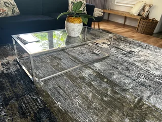 Coffee table and server from LIM Furniture-polished stainless steel and glass
