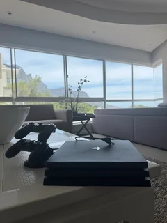 PlayStation 4 with controllers and charging station