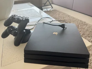 PlayStation 4 with controllers and charging station