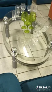 Oval glass top coffee table with aluminium frame