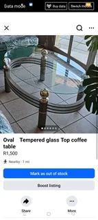 Oval glass top coffee table with aluminium frame