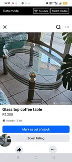 Oval glass top coffee table with aluminium frame