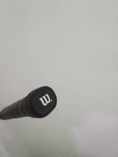 Wilson&#39;s squash racket, barely used, like new in pristine condition — price negotiable.