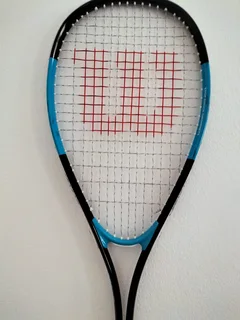 Wilson&#39;s squash racket, barely used, like new in pristine condition — price negotiable.