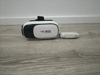 VR box with Bluetooth controller included for sale, barely used brand new pristine condition