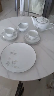 Teaset consisting of cups, saucers, side plates, cake plate &amp; teapot