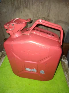 5 (five), litre Jerry can. Bright red metal can like new.