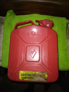 5 (five), litre Jerry can. Bright red metal can like new.