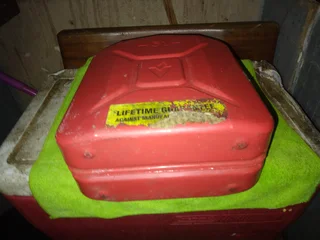 5 (five), litre Jerry can. Bright red metal can like new.