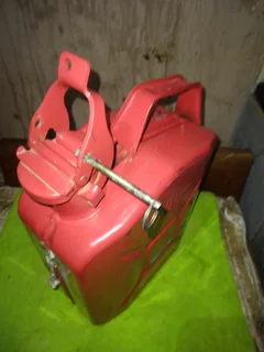5 (five), litre Jerry can. Bright red metal can like new.