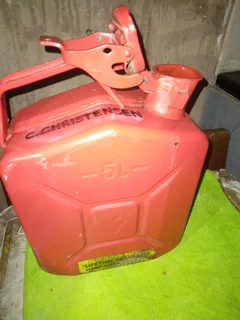 5 (five), litre Jerry can. Bright red metal can like new.