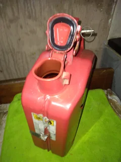 5 (five), litre Jerry can. Bright red metal can like new.