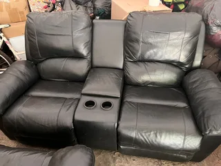 2 leather couches . One two seater one 2 seater