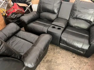 2 leather couches . One two seater one 2 seater