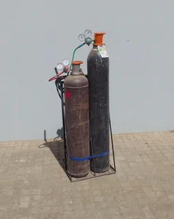 Cutting torch and gas bottle set on trolley