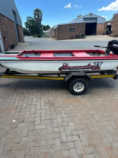 Fishing boat with 15hp mercury motor and trailer
