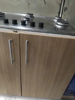 Gas stove and cupboard