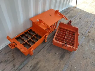 Nissan NP 200,A brick making machine and a concrete mixer