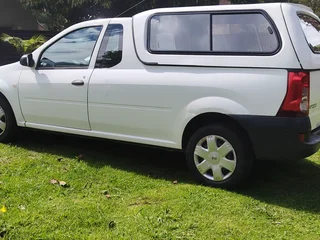 Nissan NP 200,A brick making machine and a concrete mixer