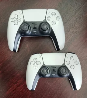 PlayStation 5 with 2 controllers and TV.