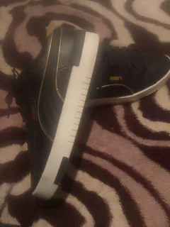 Puma black and gold