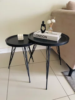 Two black side tables