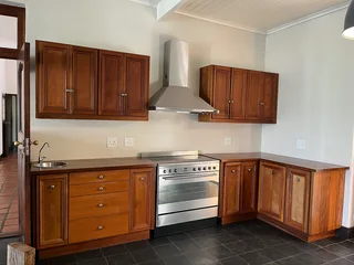 Wooden Kitchen cupboard and counter set with SMEG electric stove