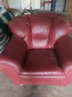 Maroon genuine leather armchair.  Small tear on right foot, but otherwise is very good condition.