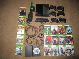 Xbox 360E+18 games+kinect & 6 remotes, charging bay and more